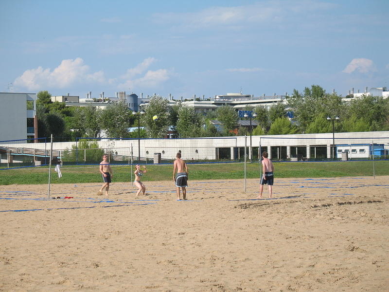Playing beach volleyball